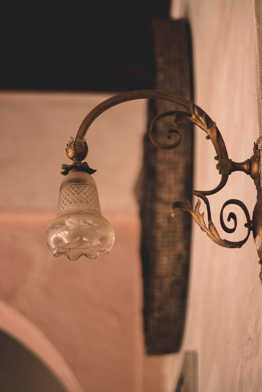 selective focus photography of brown framed sconce
